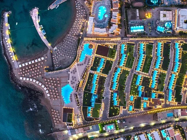 A seaside resort in the Afixis Hospitality portfolio, seen from above at dusk