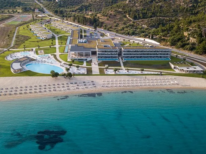 Ammoa resort above a sandy beach, seen from the air