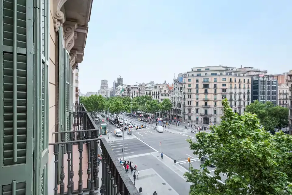 The Collection Barcelona: a balcony view over a tree-lined Barcelona avenue