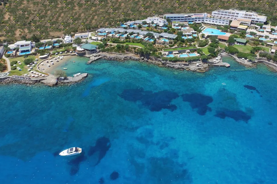 Elounda Collection Hotels & Resorts on Crete: resort and pool bungalows above a deep blue bay