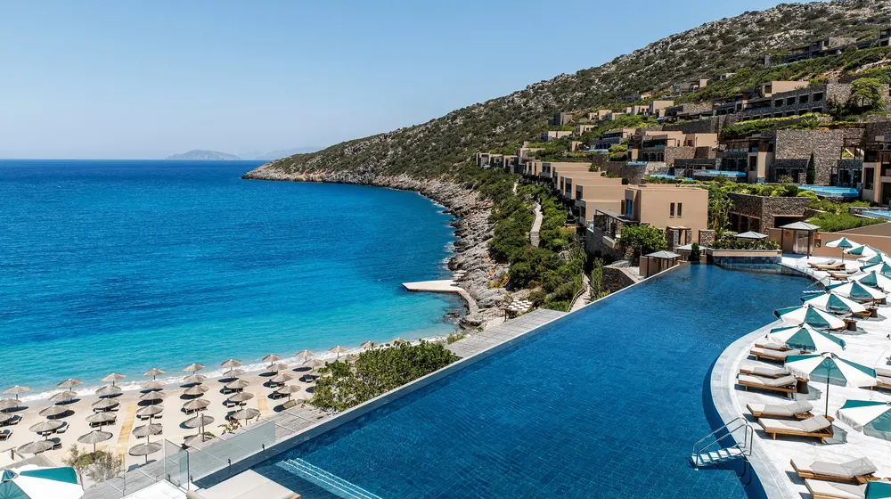 Daios Cove on Crete: an infinity pool above a private cove, villas stepped up the hillside