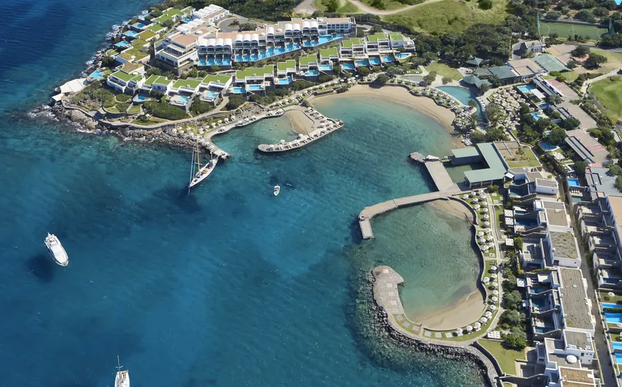 Elounda Collection Hotels & Resorts on Crete: suites, sandy coves and yachts on turquoise water, from the air